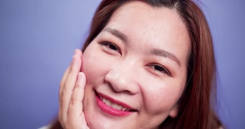 Close up portrait of attractive Asian woman happy smiling and confident cheerful with soft focus vio