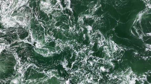 Aerial View of Ocean Waves and Dark Green Water