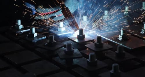 Heavy Industry Worker in Protective Mask Welds Steel and Other Products in a Factory Environment