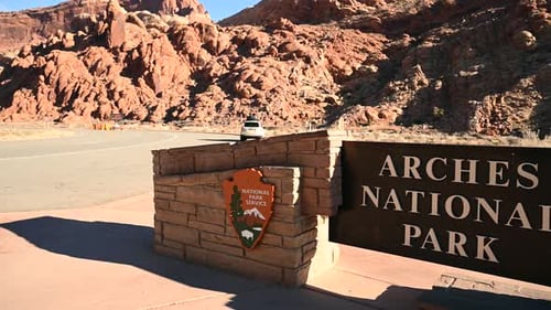 Pan from Arches National Park to the entrance station, handheld
