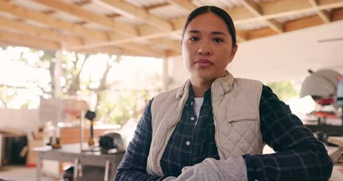 Carpenter woman, face and workshop for wood, construction and building in small business
