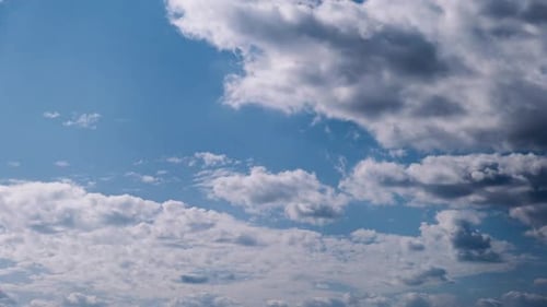 Timelapse of Cumulus Clouds Moves In The Blue Sky