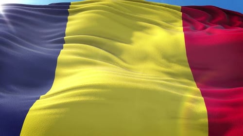 Realistic Waving Flag of Romania Against Blue Sky