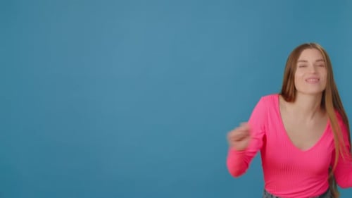 Woman Dancing in a Pink Shirt