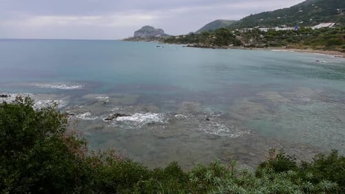 Looking across the sea towards Cefalu on the Island of Sicily. Italy. 2023