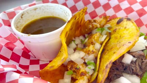 A plate of delicious birria tacos; a dish that is very popular in Mexico that consist of goat meat o
