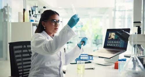 Female Scientist Conducting Experiment in Modern Laboratory