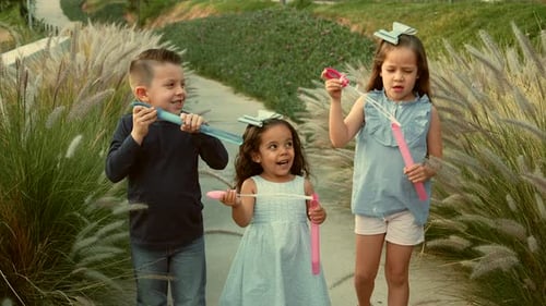 children siblings friends cousins happy enjoying their friendship playing laughing in the park
