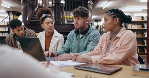 University, students or group with laptop in library for educational discussion