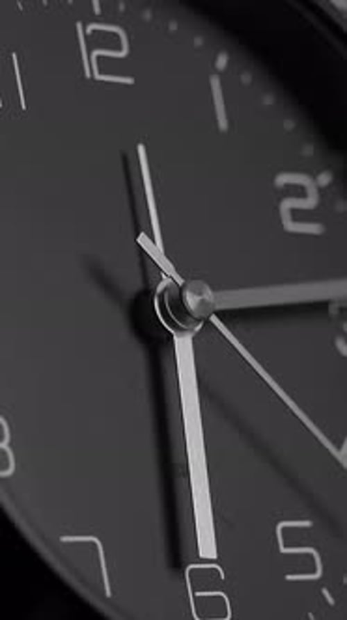 An Intricate CloseUp View of a Modern Analog Clock Face Presented in Monochrome Tones
