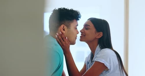 Loving Young Couple Kissing Tenderly Indoors