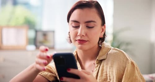 Woman Using Phone at Home in Natural Light