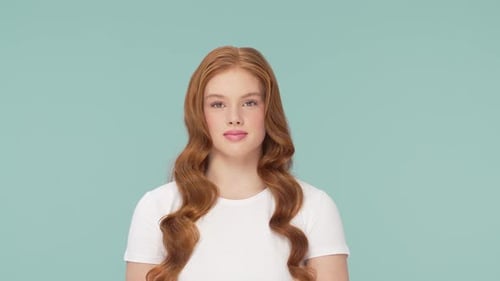 Beautiful Teenage Redhead Girl Posing in Studio Female of Cute Female Teenager Over Bright Solid