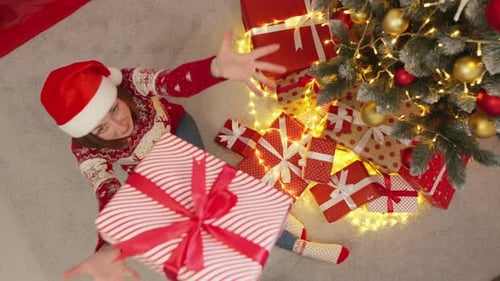 Overhead View of Woman with Christmas Gift