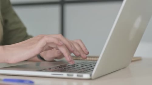 Close Up of Blonde Woman Typing on Laptop