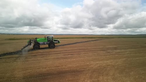 Sprayer Fertilizes the Field With Chemicals Aerial
