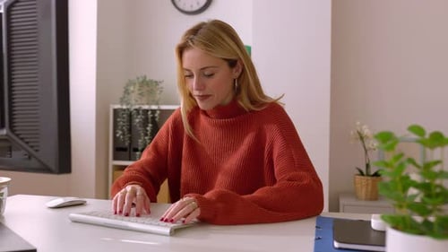 Happy Young Beautiful Woman Working on Laptop at Home Office