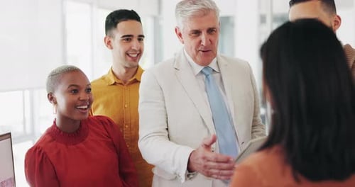 Diverse Group Celebrates Business Success in Modern Office