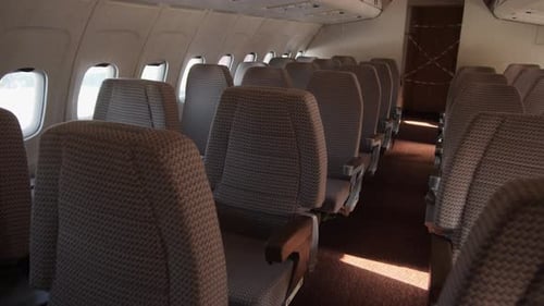 Interior Airplane Seating Area with Empty Seats