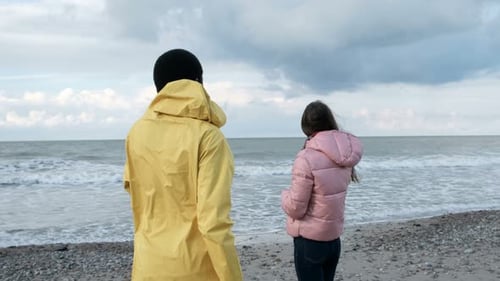 African american couple embracing on autumn beach vacation seaside romance