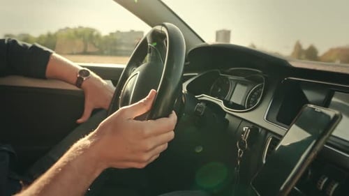 Driving a Car Through the City During the Day