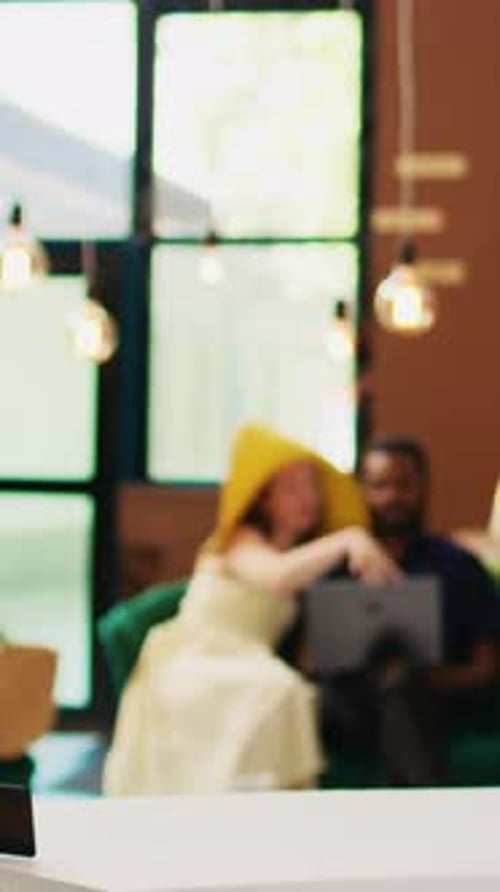 Vertical Video Diverse Travellers Using Laptop in Lobby