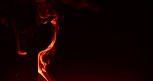 Abstract fine red smoke expires. Isolated on black background. 4k DCI footage.