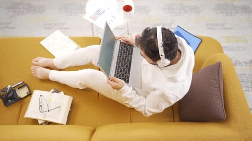 Man Frustrated While Working on Laptop at Home