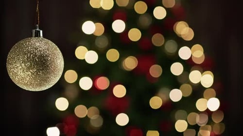 Gold Christmas Ornament with Bokeh Lights