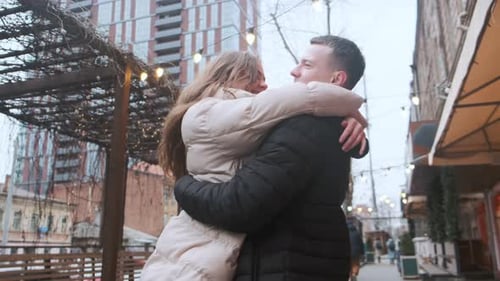 Romantic Couple Embracing in Urban Setting