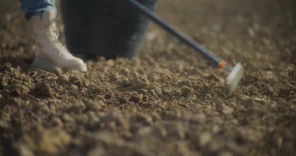 Close Up Of Rake Breaking Up Clods Of Soil, People Stock Footage ft ...