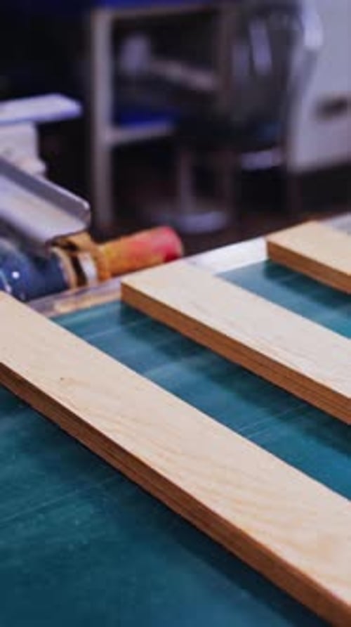 Wooden Planks on a Conveyor Belt in Factory