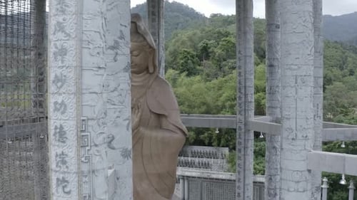 Close up tracking shot Kuan Yin statue, Kek Lok Si Temple, Malaysia, Penang Hill, no people, dayligh