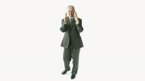 Mature Man in Suit Poses Against White Background