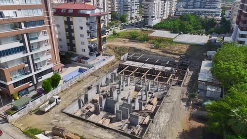 Aerial View Construction Site Activity Workers and Equipment Busy at Work