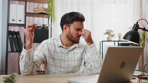 Young Adult Tired After Computer Work