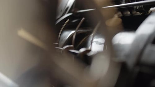 Detail of an original Heidelberg printing machine, roller turning printed paper on its roller.