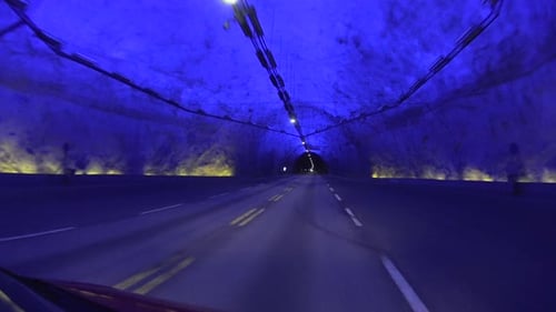 Road tunnel. Blue version. Driving at night.