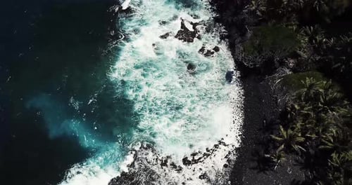 Black Sand Beach at Isaac Hale Beach Park (Pohoiki) on Big Island of Hawaii - Aerial View Ascending.