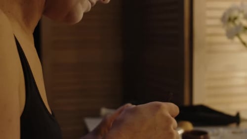 Mime Artist Doing Stage Makeup with Black Gel Liner