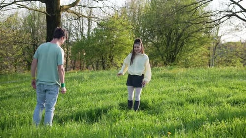 A Young Couple Happily Enjoying a Beautiful and Joyful Spring Day Together in the Park