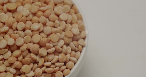 Bowl of dried peas sits on table