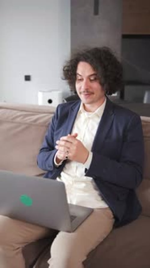 Young Adult on Video Call with Laptop