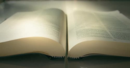 Magical Glowing Pages of an Open Book Closeup Reading Knowledge Concept University Library