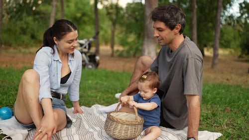 Family Picnic in a Sunny Green Park
