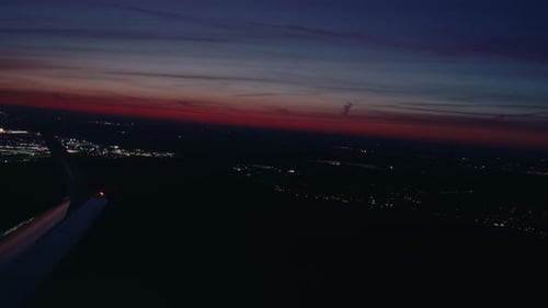 Airplane flying over city