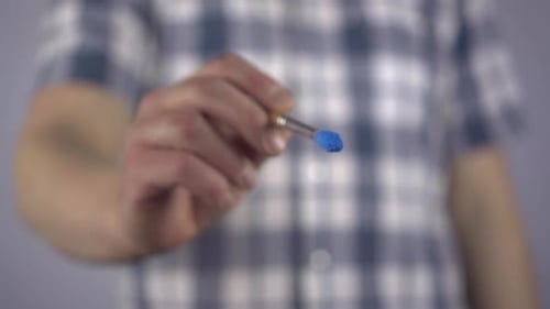 A Young Man Draws a Symbol of Diabetes on the Glass