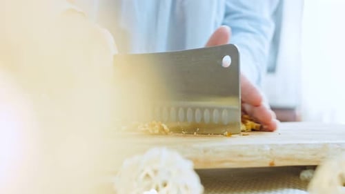 The Woman Chops the Walnut