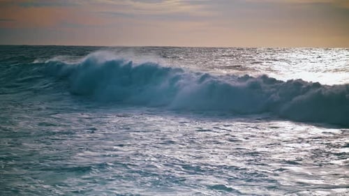 Foamy Waves Rolling Sunrise Shore . Beautiful Seaside Evening View. Powerful