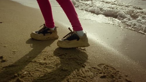 Child Legs Walking Beach Water at Sea Shore. Unknown Little Girl Dancing